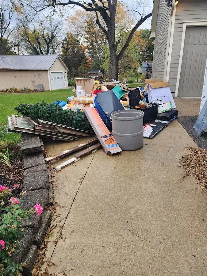 Dumpster being loaded with debris for Commercial Dumpster Rental in Chickamauga